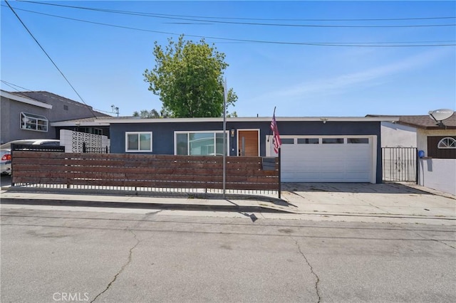 1343 Cordon Dr, City Terrace, CA 90063 - view of front facade with an attached garage, a fenced front yard, and concrete driveway