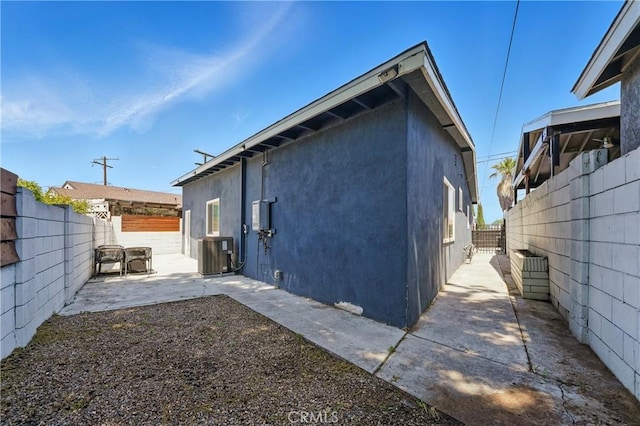 1343 Cordon Dr, City Terrace, CA 90063 - rear view of house with stucco siding, a patio, and a fenced backyard