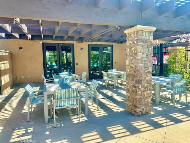 16759 Yellow Fern Ln, Fontana, CA 92336 - view of patio / terrace featuring french doors, outdoor dining area, and fence