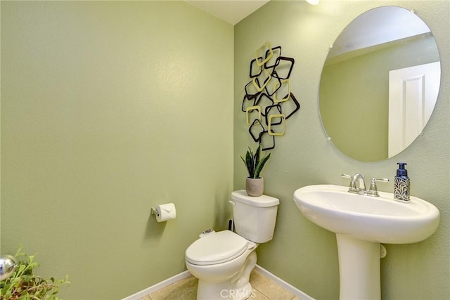 16759 Yellow Fern Ln, Fontana, CA 92336 - bathroom featuring tile patterned floors, toilet, baseboards, and a sink
