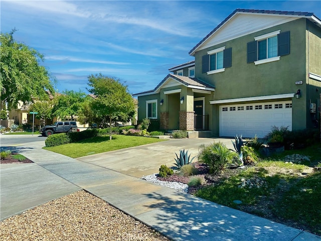 16759 Yellow Fern Ln, Fontana, CA 92336 - view of front of property with a garage, driveway, stucco siding, and brick siding