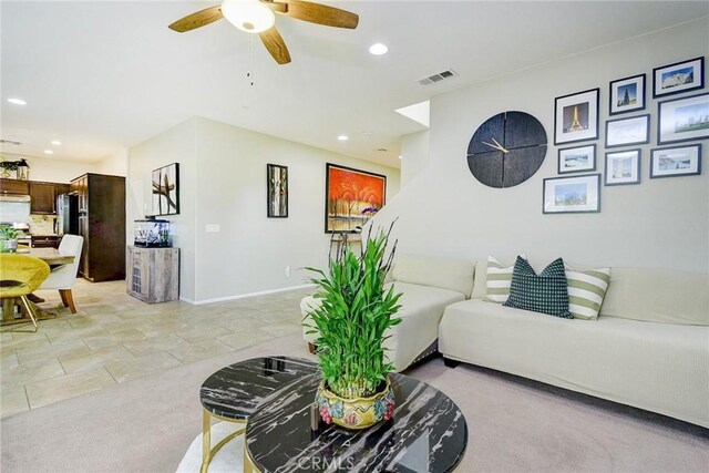 16759 Yellow Fern Ln, Fontana, CA 92336 - living room with recessed lighting, ceiling fan, baseboards, and light carpet
