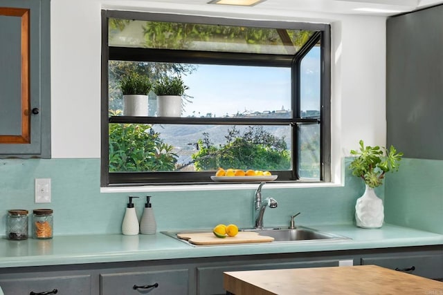 bar featuring backsplash and a sink