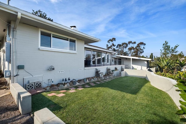 view of property exterior with a yard