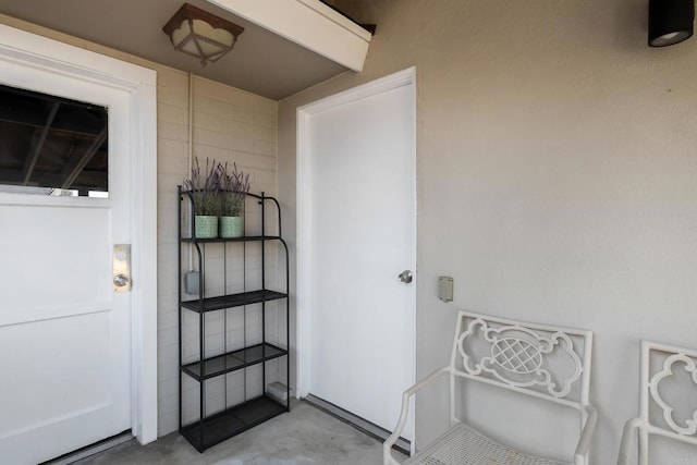 entrance to property with stucco siding