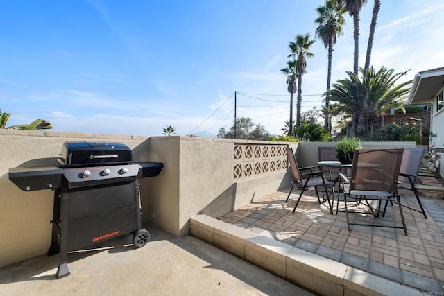 view of patio / terrace with a grill and outdoor dining space