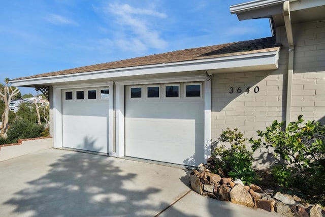 garage featuring driveway