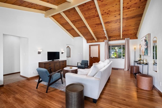 living room featuring wood finished floors, beamed ceiling, baseboards, high vaulted ceiling, and wooden ceiling