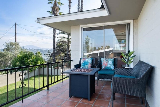 balcony featuring a fire pit and a mountain view