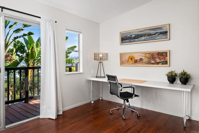 office space with wood finished floors and baseboards