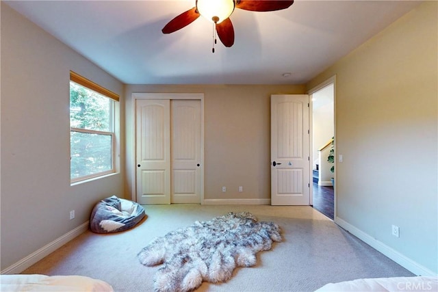 5595 Tanbark Ct, Avila Beach, CA 93424 - bedroom featuring light carpet, a closet, baseboards, and ceiling fan