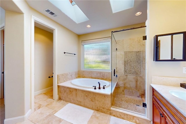 5595 Tanbark Ct, Avila Beach, CA 93424 - full bath featuring a garden tub, a shower stall, vanity, tile patterned floors, and a skylight