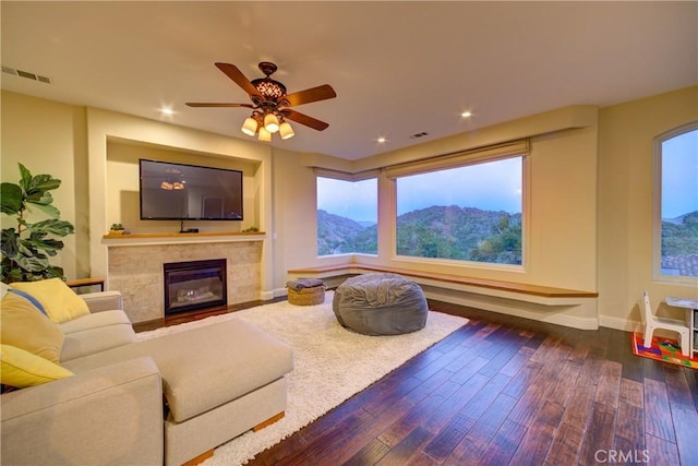 5595 Tanbark Ct, Avila Beach, CA 93424 - living area featuring dark wood-style floors, baseboards, a tile fireplace, ceiling fan, and recessed lighting