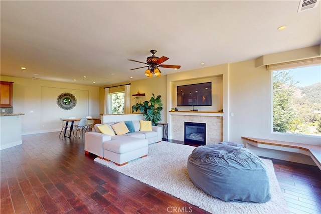 5595 Tanbark Ct, Avila Beach, CA 93424 - living area featuring dark wood-type flooring, a tile fireplace, recessed lighting, ceiling fan, and baseboards