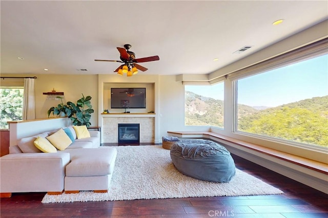 5595 Tanbark Ct, Avila Beach, CA 93424 - living area featuring a glass covered fireplace, wood-type flooring, ceiling fan, and recessed lighting