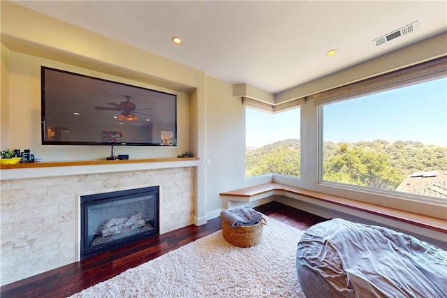5595 Tanbark Ct, Avila Beach, CA 93424 - living room featuring wood finished floors, a glass covered fireplace, recessed lighting, and baseboards