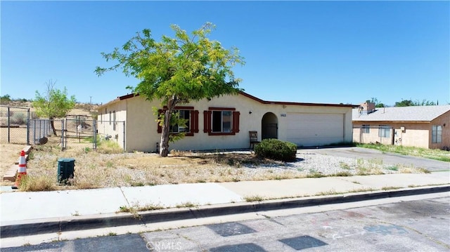 16615 Batson Pl, Victorville, CA 92395 - ranch-style home featuring stucco siding, a garage, driveway, and fence