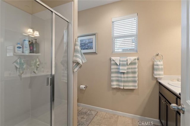3293 Rogue River Dr, Chico, CA 95973 - full bathroom with a stall shower, vanity, and baseboards