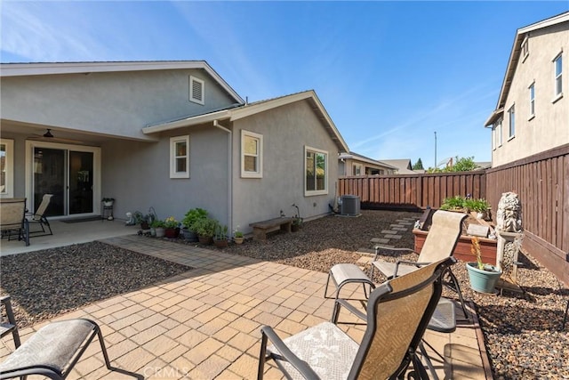 3293 Rogue River Dr, Chico, CA 95973 - back of property with stucco siding, a patio area, a fenced backyard, and cooling unit