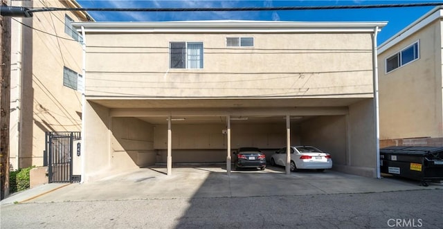 442 E Santa Anita Ave, Burbank, CA 91501 - exterior space with stucco siding, covered parking, and a gate