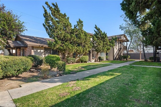 10353 Carefree Dr, Santee, CA 92071 - view of property hidden behind natural elements featuring stairway and brick siding