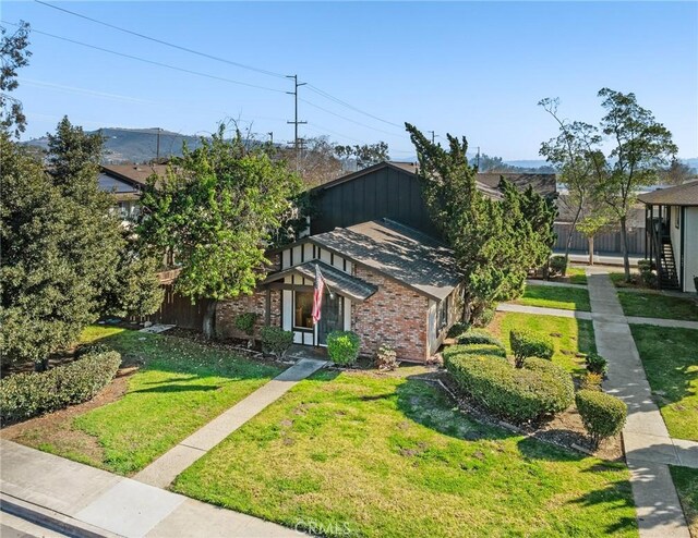 10353 Carefree Dr, Santee, CA 92071 - view of front of home featuring a front lawn and brick siding