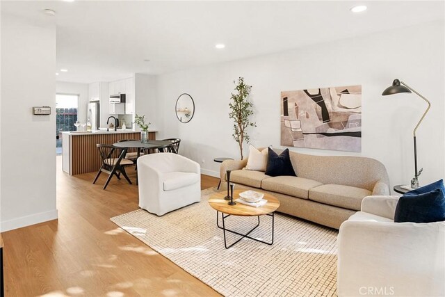 10353 Carefree Dr, Santee, CA 92071 - living area featuring light wood-style flooring, baseboards, and recessed lighting