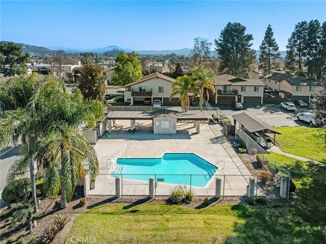 10353 Carefree Dr, Santee, CA 92071 - community pool featuring a residential view, a mountain view, and a patio area