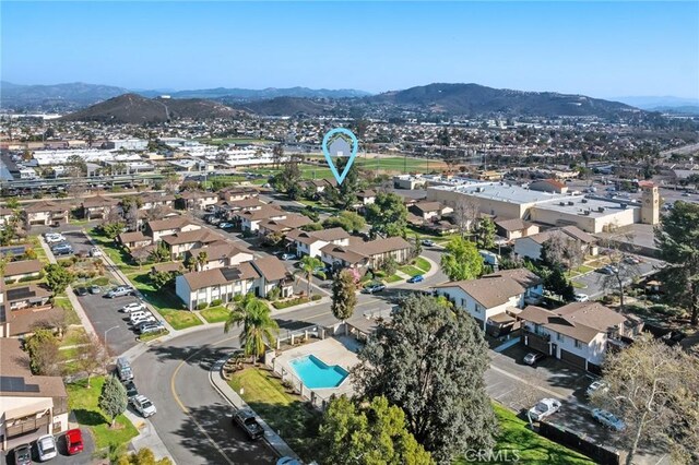 10353 Carefree Dr, Santee, CA 92071 - aerial view of property's location with mountains, a pool, and nearby suburban area