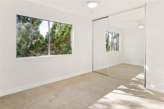 10353 Carefree Dr, Santee, CA 92071 - unfurnished bedroom featuring carpet, multiple windows, a closet, and baseboards