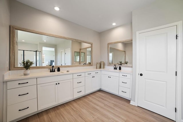 4650 Silent Knoll Dr, Fallbrook, CA 92028 - bathroom featuring wood finished floors, double vanity, recessed lighting, and a shower
