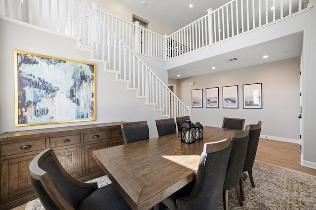 4650 Silent Knoll Dr, Fallbrook, CA 92028 - dining space featuring a towering ceiling, wood finished floors, baseboards, stairs, and recessed lighting