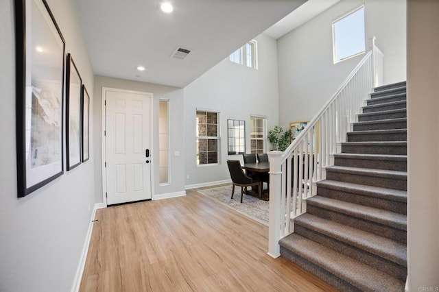 4650 Silent Knoll Dr, Fallbrook, CA 92028 - foyer with stairway, light wood-style flooring, baseboards, recessed lighting, and a high ceiling