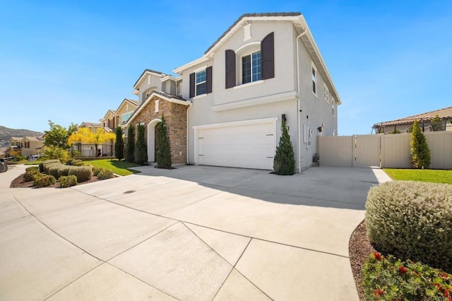 4650 Silent Knoll Dr, Fallbrook, CA 92028 - traditional-style house featuring concrete driveway, fence, stucco siding, a garage, and a gate