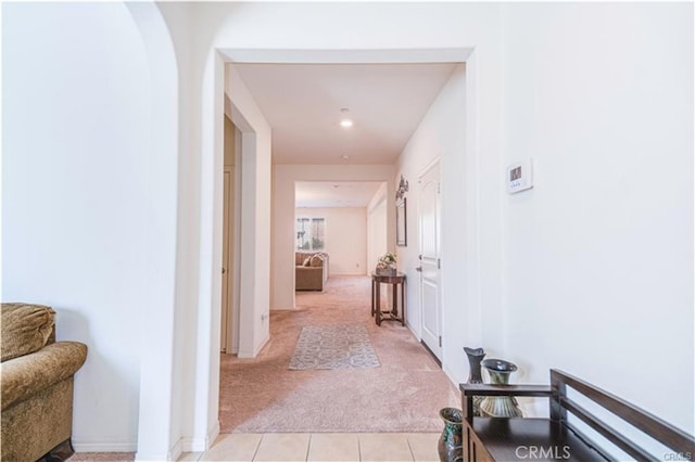 15590 Pumpkin Pl, Fontana, CA 92336 - corridor featuring light colored carpet, light tile patterned floors, and recessed lighting