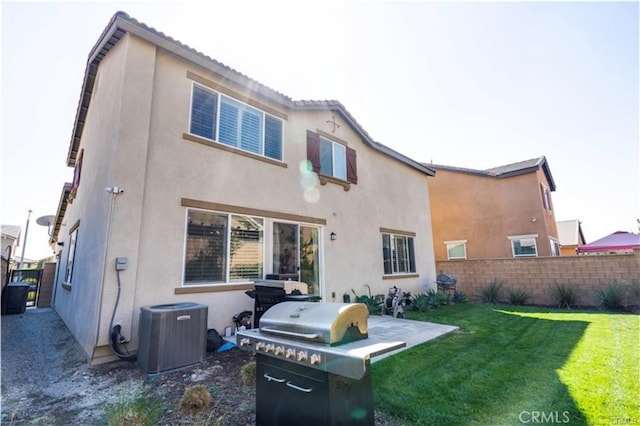 15590 Pumpkin Pl, Fontana, CA 92336 - back of property featuring stucco siding and central air condition unit