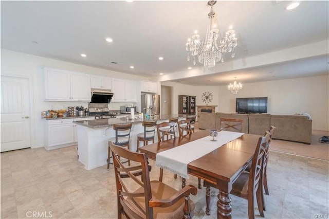 15590 Pumpkin Pl, Fontana, CA 92336 - dining space with a chandelier and recessed lighting