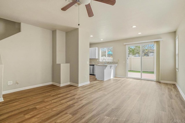 2550 Garnet Peak Rd, Chula Vista, CA 91915 - unfurnished living room featuring light wood-style flooring, baseboards, recessed lighting, and a ceiling fan
