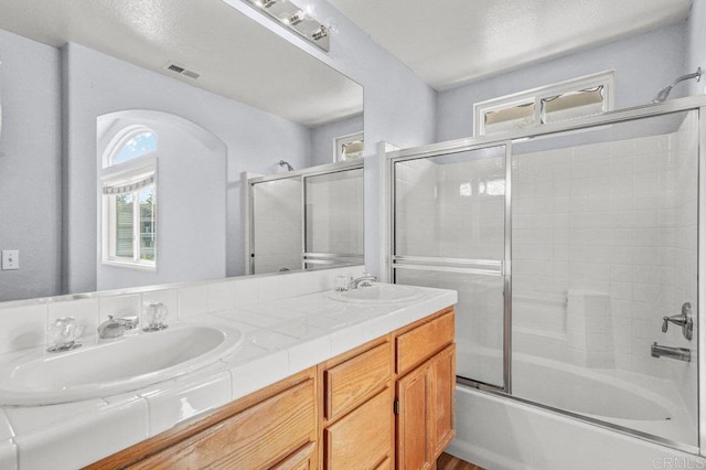 2550 Garnet Peak Rd, Chula Vista, CA 91915 - full bathroom featuring combined bath / shower with glass door and double vanity
