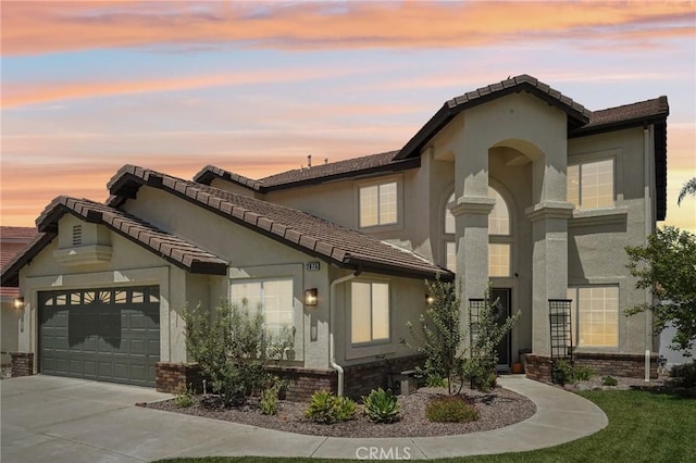 2875 Briarhaven Ln, Corona, CA 92882 - mediterranean / spanish-style house with stucco siding, an attached garage, driveway, and a tiled roof