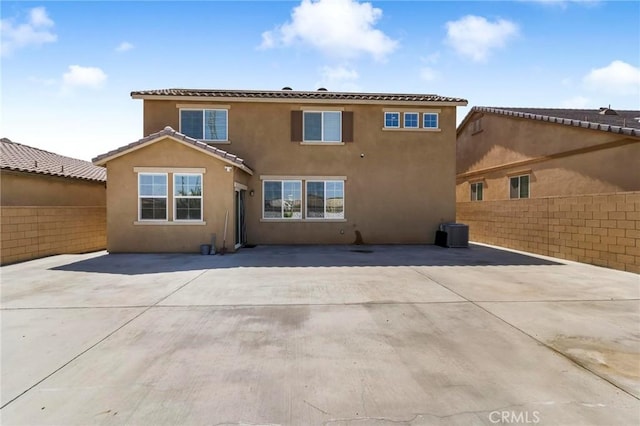 15070 Paseo Verde Pl, Victorville, CA 92394 - back of property with stucco siding, a patio area, and a tile roof