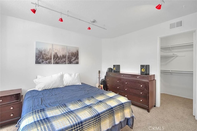 6730 Harrington Ct, Chino, CA 91710 - bedroom with a walk in closet, light carpet, and a closet