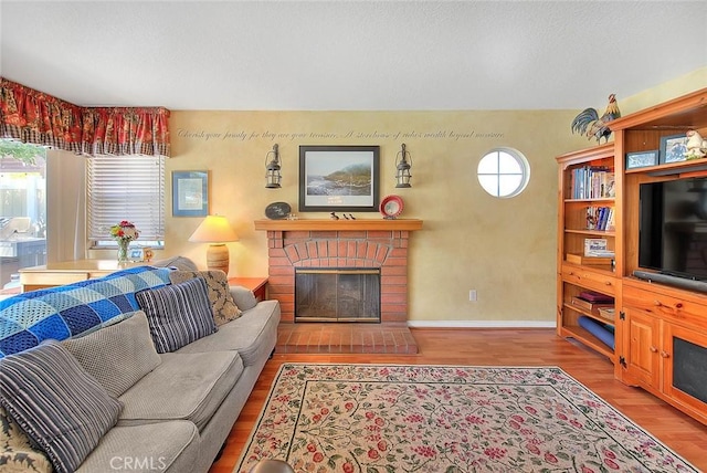 6730 Harrington Ct, Chino, CA 91710 - living area featuring wood finished floors, a fireplace, and baseboards