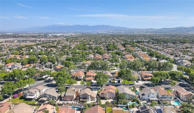 6730 Harrington Ct, Chino, CA 91710 - aerial view of property's location featuring a mountain backdrop and nearby suburban area