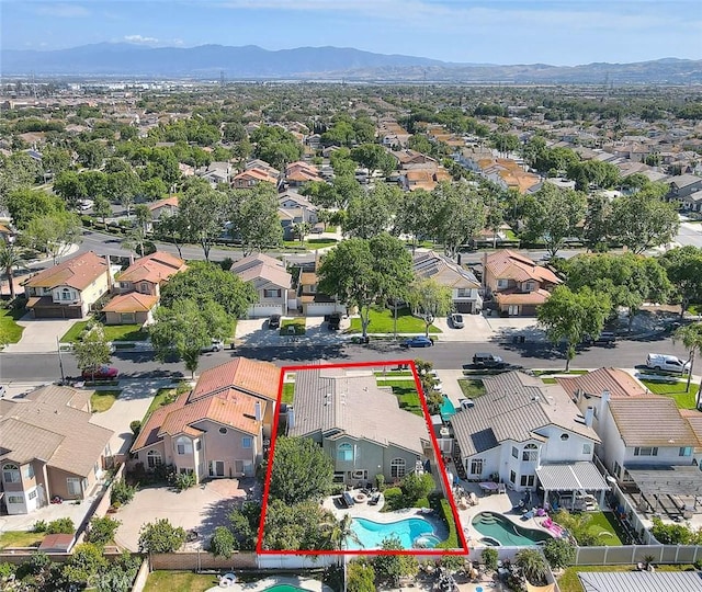 6730 Harrington Ct, Chino, CA 91710 - aerial view of residential area with property parcel outlined, mountains, and a pool
