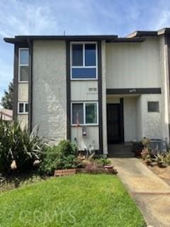 4676 Maxwell Ct, Riverside, CA 92501 - view of front of property featuring a front lawn and stucco siding
