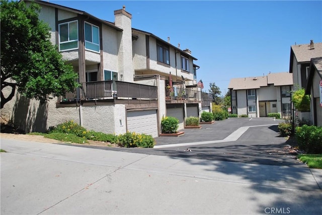 4676 Maxwell Ct, Riverside, CA 92501 - view of concrete road featuring a residential view