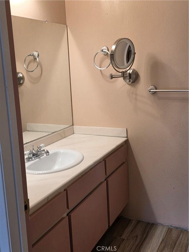 4676 Maxwell Ct, Riverside, CA 92501 - bathroom featuring vanity and wood finished floors