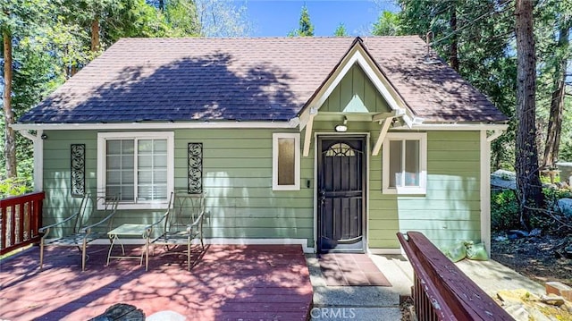23120 Sycamore Ln, Crestline, CA 92325 - view of front of house with a deck and roof with shingles