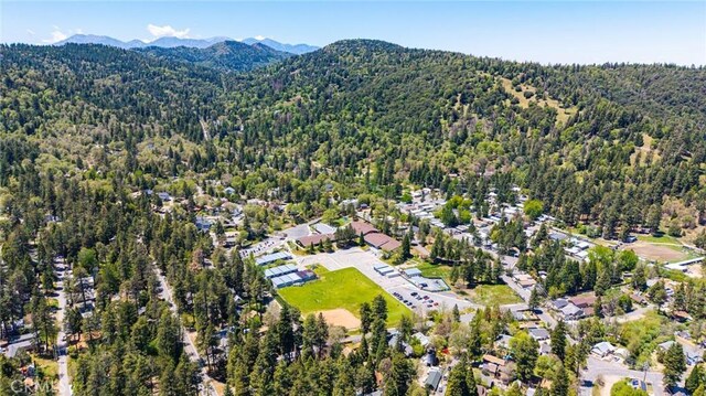 23120 Sycamore Ln, Crestline, CA 92325 - aerial view of a forest and mountains